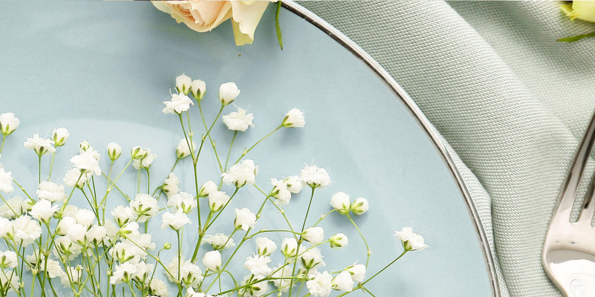Pale blue plate with baby's breath flowers on it